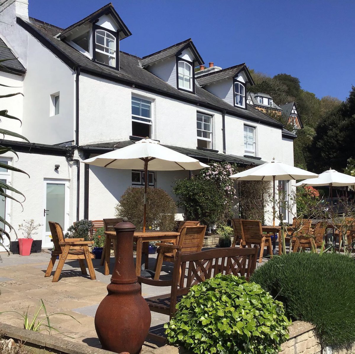 Front of Torrs Cottage and the sun terrace with plenty of seating